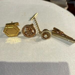 Men’s tie accessories in gold tone